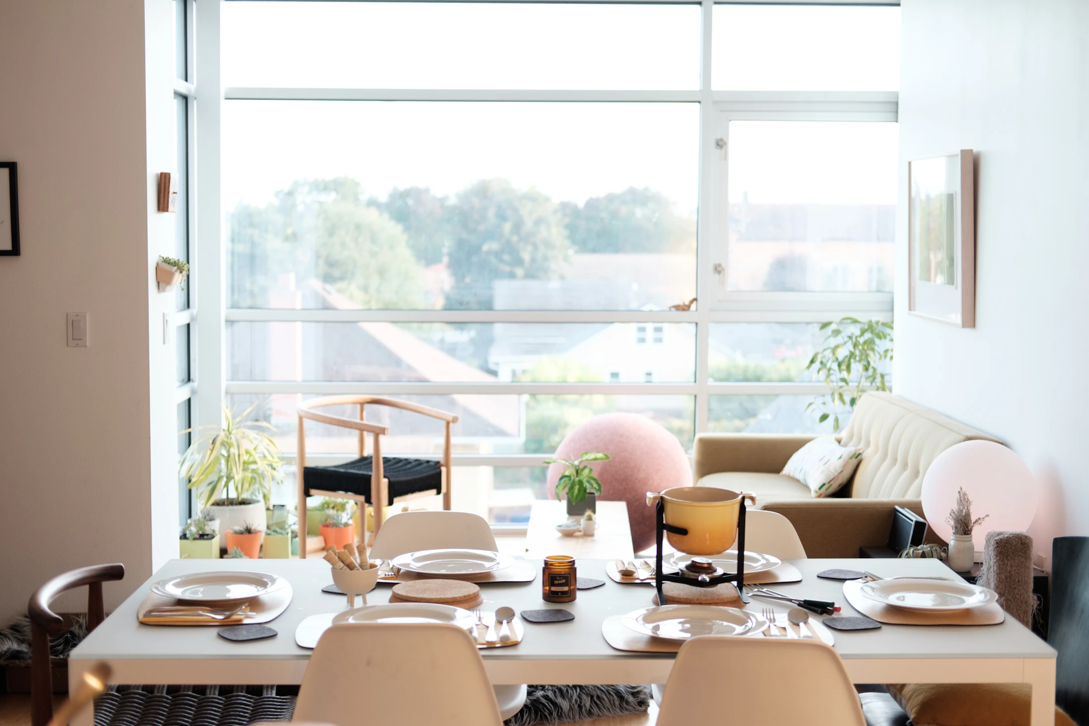 A bright shared living and dining room set for an ordinary day at home